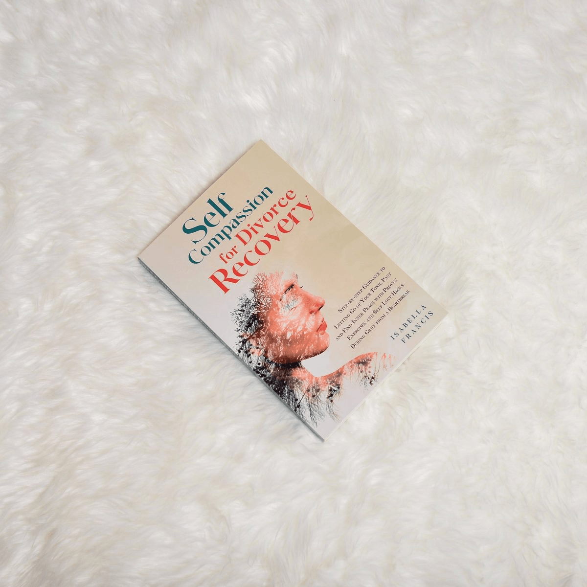 The Self-Compassion paperback on a white fur rug